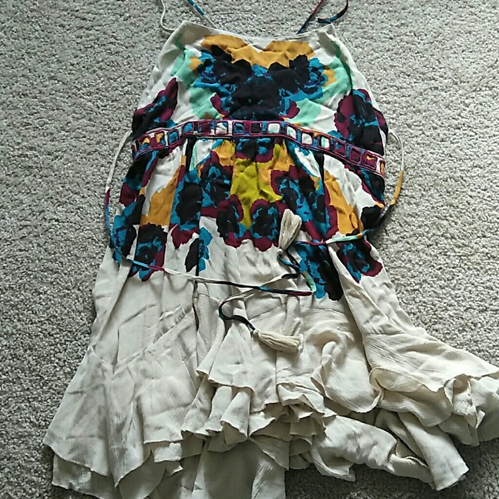 Abstract low open back cross strapped dress.